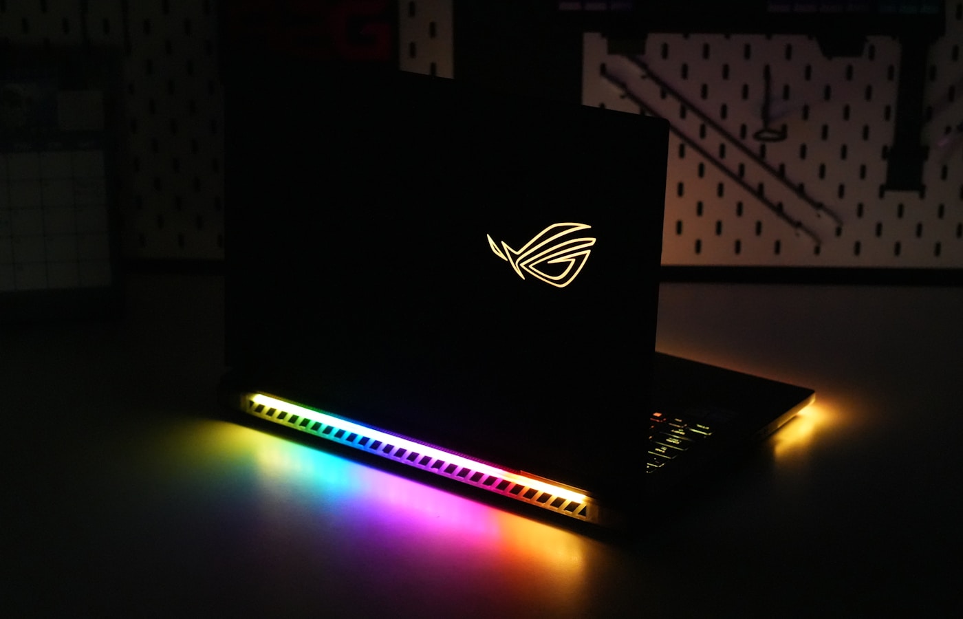 RGB-lit gaming desk setup with keyboard and controller
